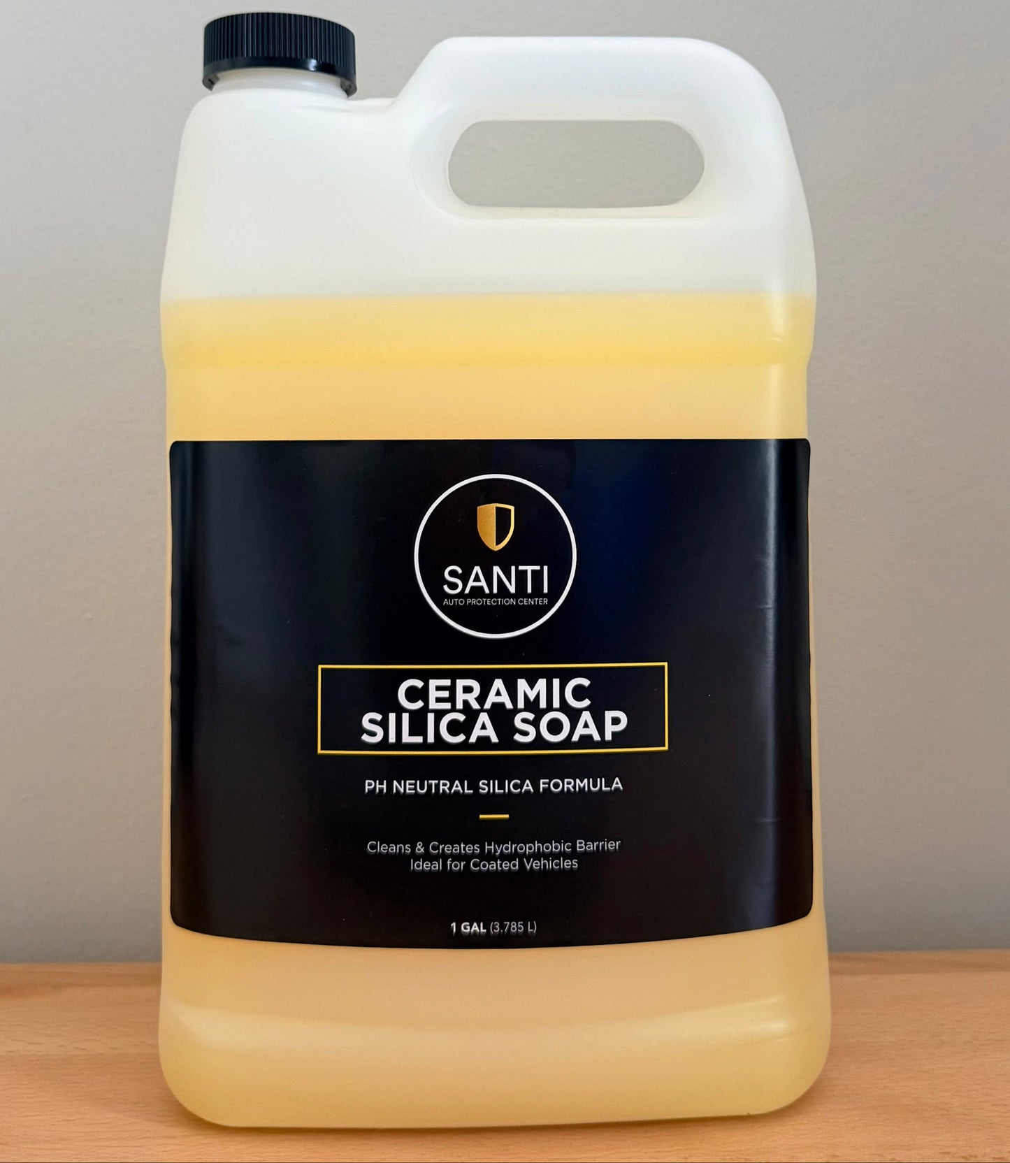 Jug of Santi Ceramic Silica Soap on a wooden surface with a neutral background